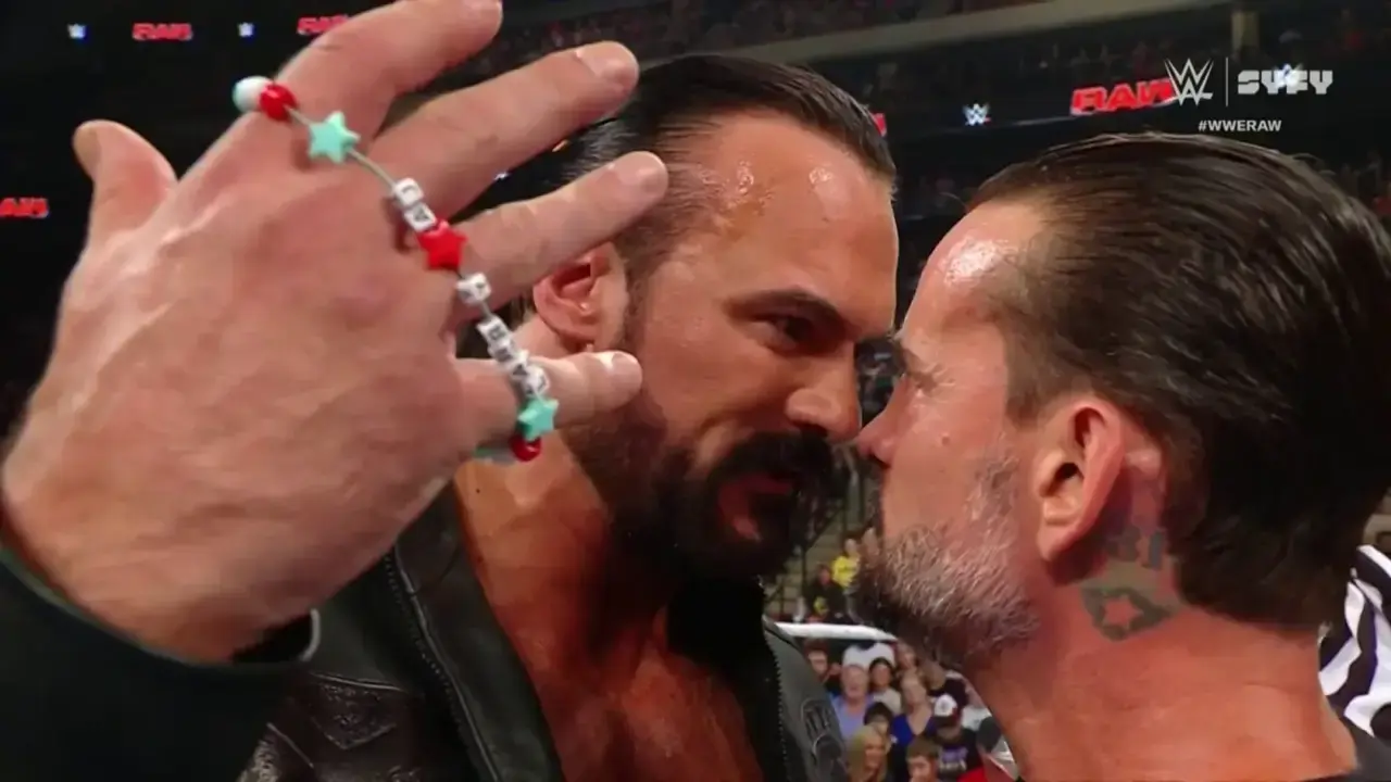 Drew McIntyre holds CM Punks bracelet in a confrontation on WWE Raw 1680x945 1