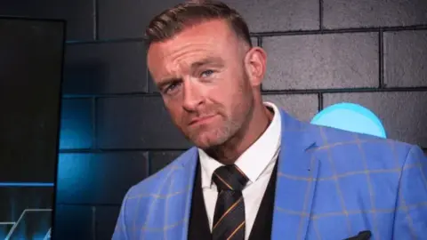 Nick Aldis’ SmackDown GM role at risk after Triple H confronts Kevin Owens at SNME