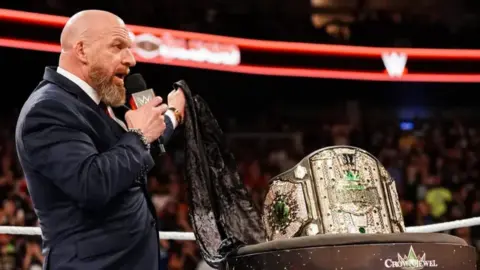 Triple H awards honorary title to Travis Scott ahead of WWE RAW’s Netflix debut