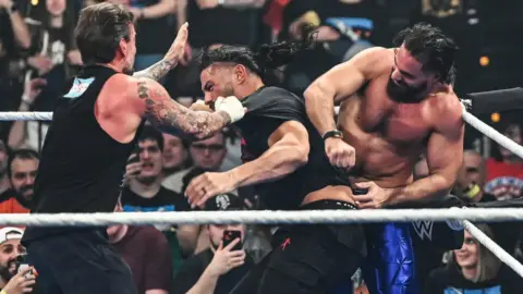 CM Punk Reacts to Huge Brawl with Roman Reigns, Seth Rollins on SmackDown