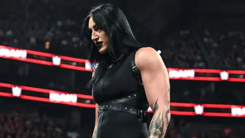 Former WWE Writer Criticizes Rhea Ripley Over ‘Unsettling’ Fan Incident